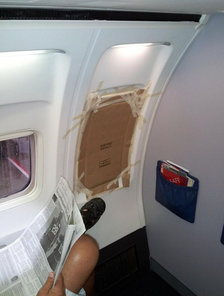 an airplane window taped up
