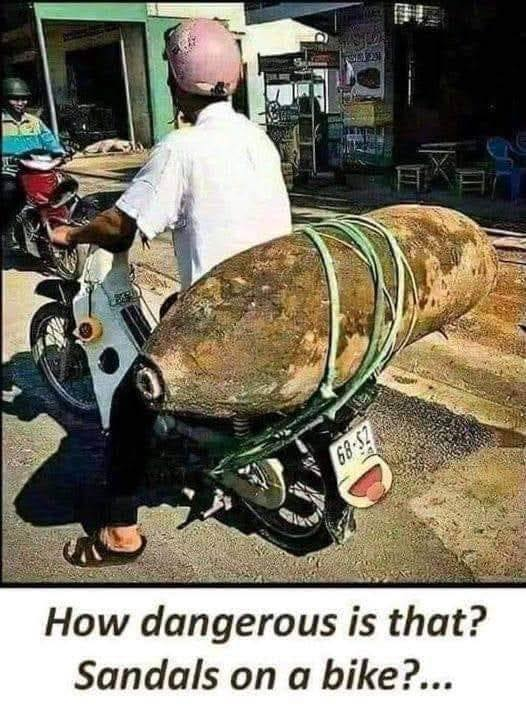How dangerous is that? Sandals on a bike?...