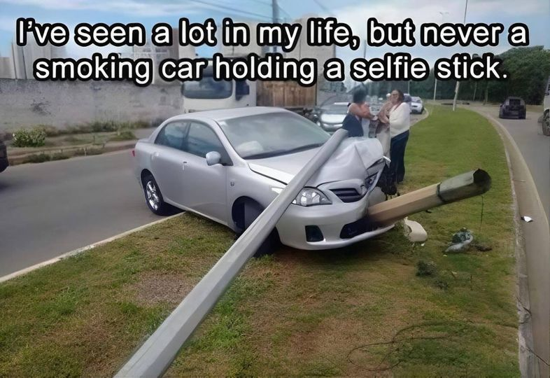 Ive seen a lot in my life, but never a smoking car holding a selfie stick.